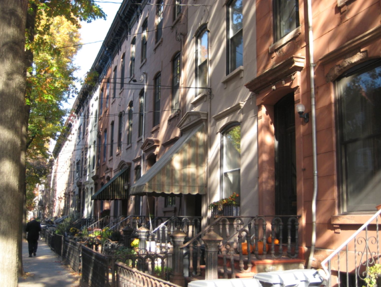 Classic Hoboken brownstone on tree-lined street