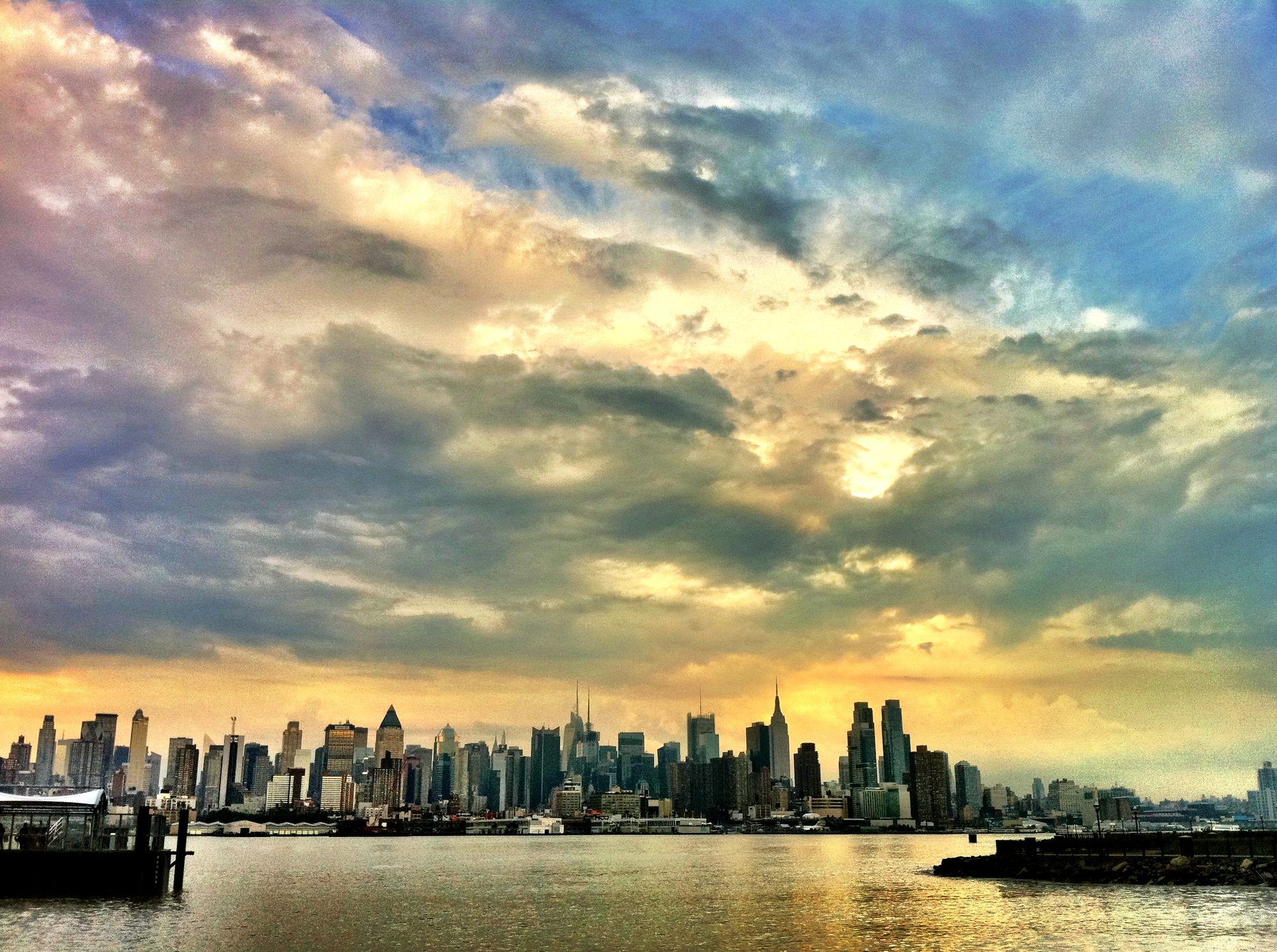 Port Imperial waterfront at sunrise with Manhattan skyline